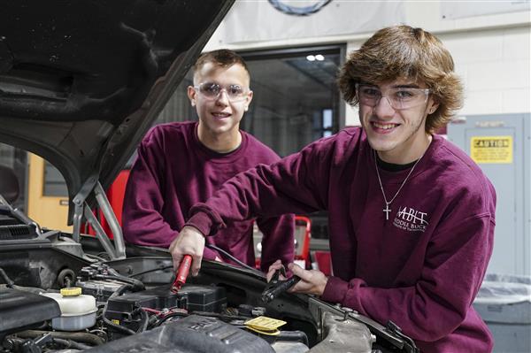 Automotive Technology student working on cars